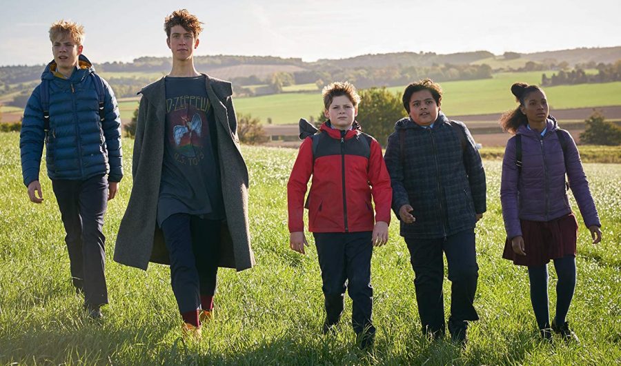 Louis Ashbourne Serkis (center) stars in The Kid Who Would Be King.