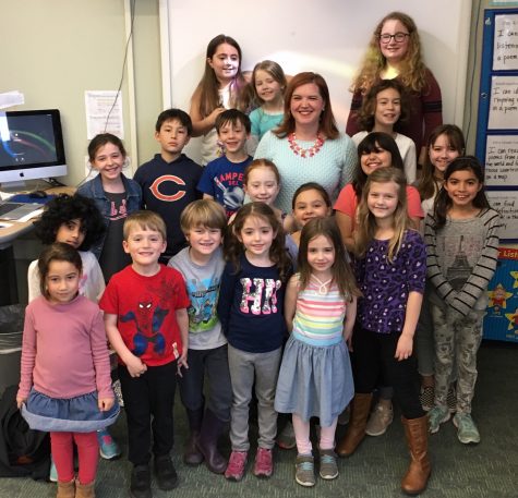 Erin Moulton, the next principal at Hosmer Elementary School in Watertown, poses with Husky Howl reporters after an interview in the newsroom Tuesday, April 9, 2019.